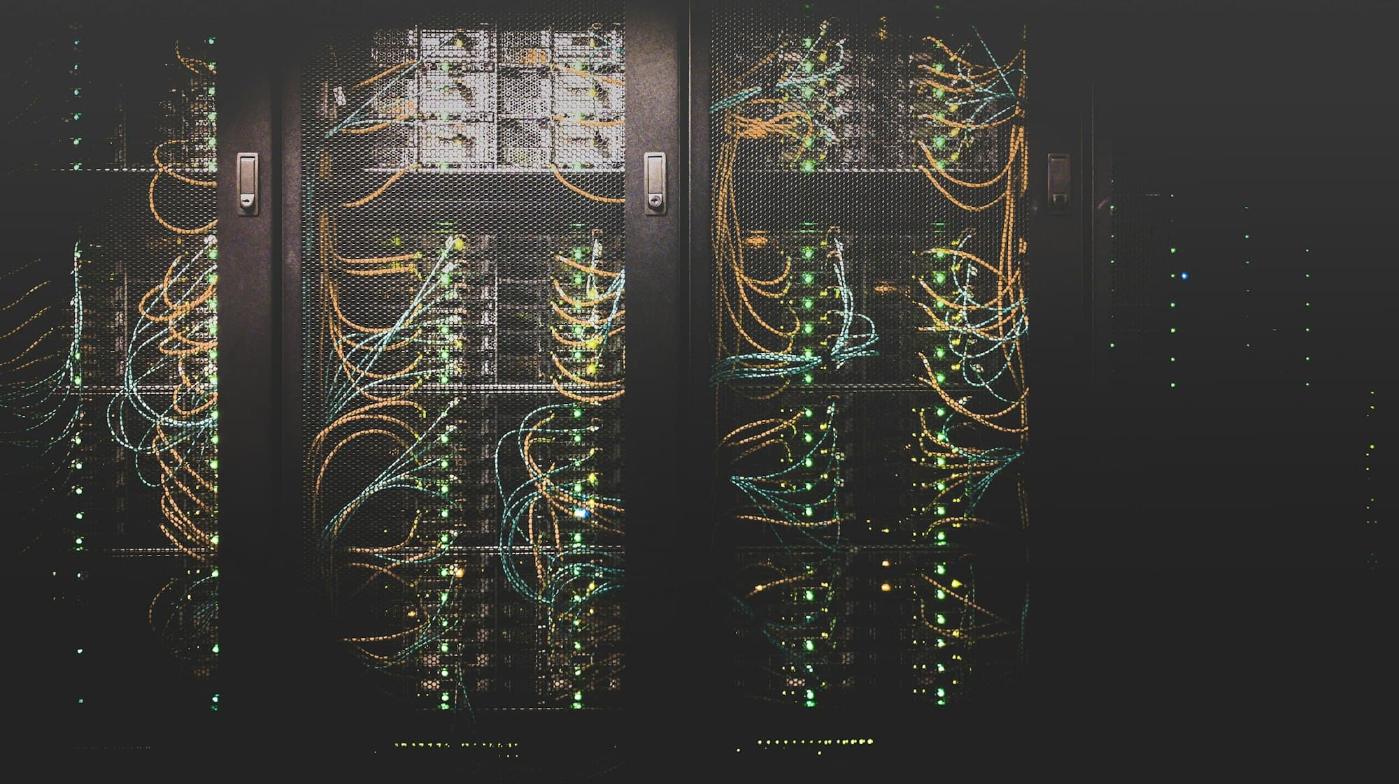 Rows of server racks with colorful cabling