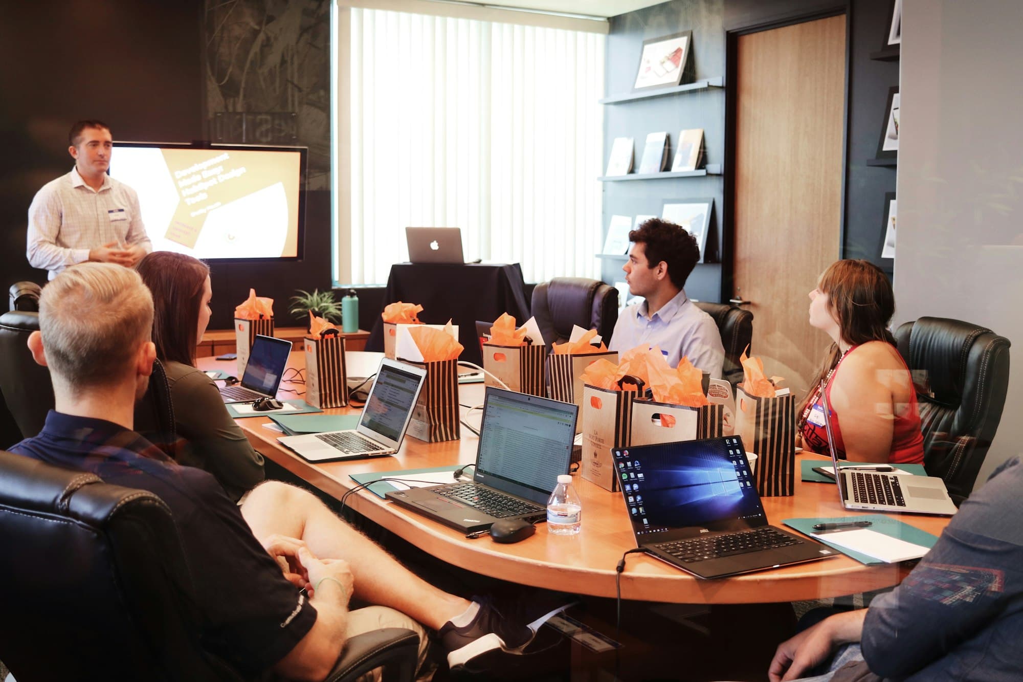 Team in a meeting room watching a presentation